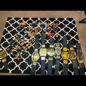 Lot of 55 wrestling figures and 7 kids championships